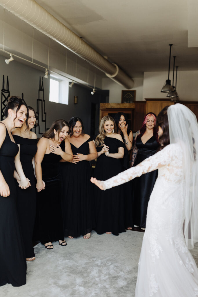 first look with bridesmaids,  bridesmaids reveal, bridesmaids reaction photos, first look with bridesmaids, all black bridesmaids dresses, black bridesmaids dresses
