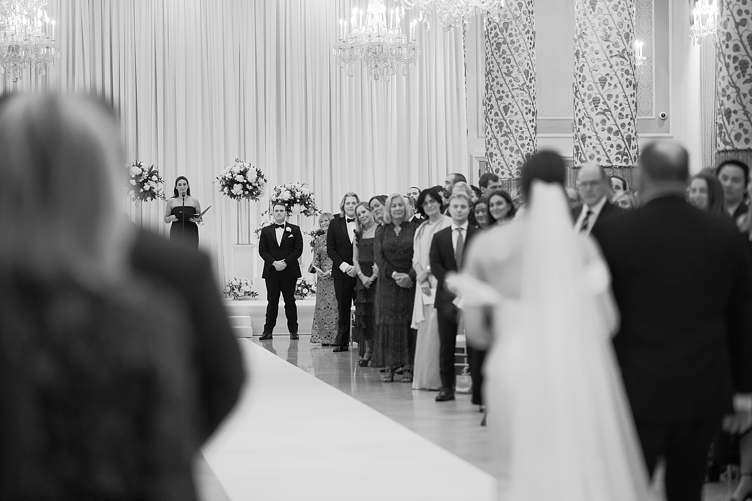 groom watches bride walk down the aisle by Chicago wedding photographer