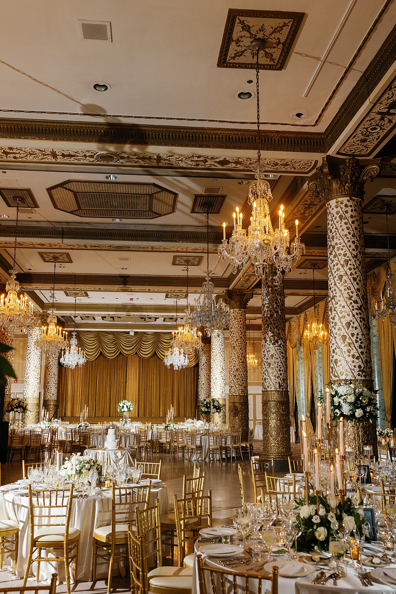 ornate ballroom set up for elegant reception by Chicago wedding photographer