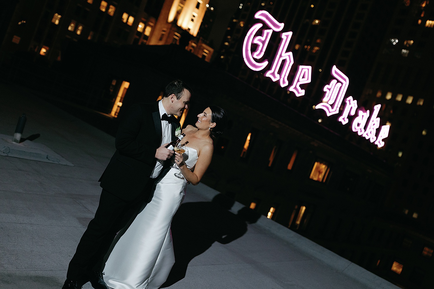 newlyweds on the rooftop at night at The Drake