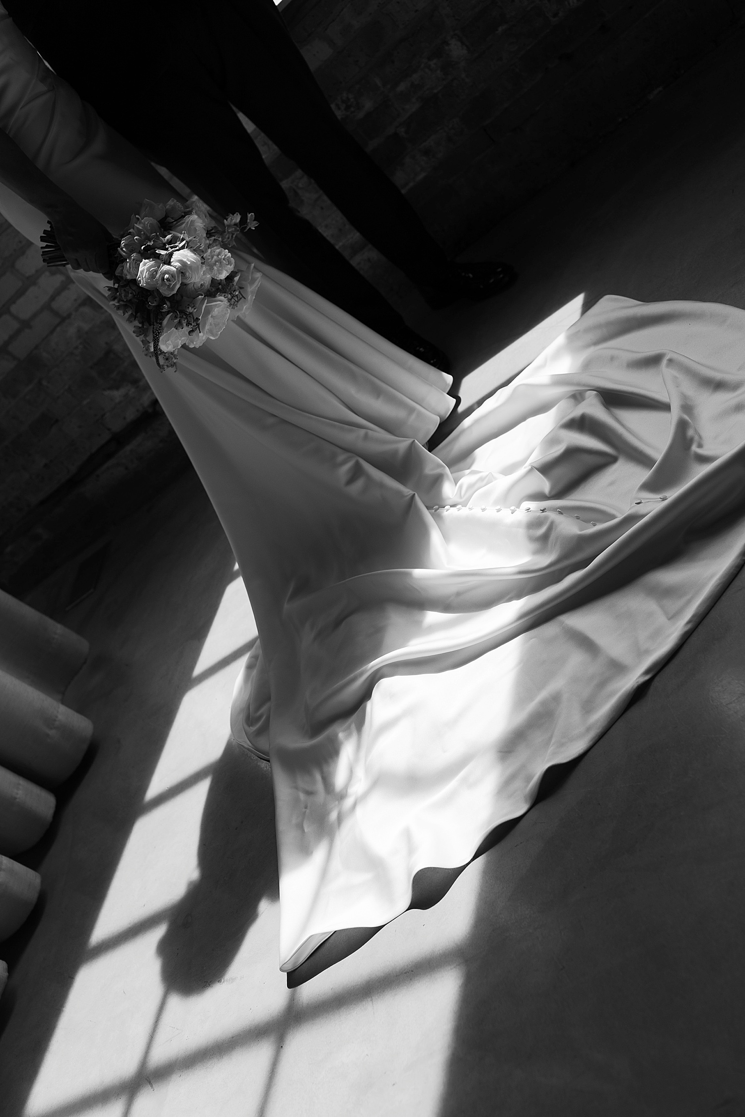 bride's gown drapes across the floor by Chicago editorial photographer