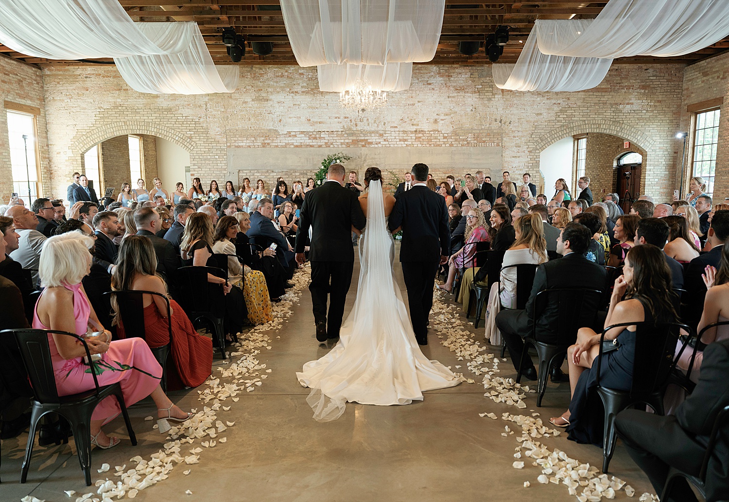 woman walks down ornate aisle by Chicago editorial photographer